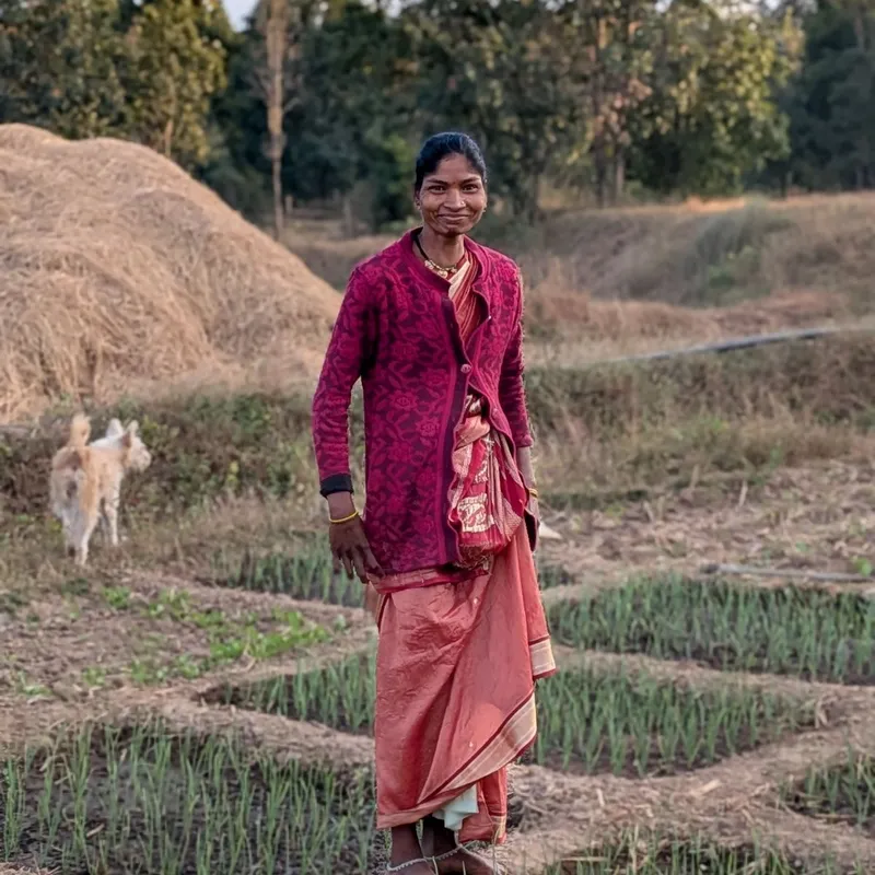 local woman in field, India