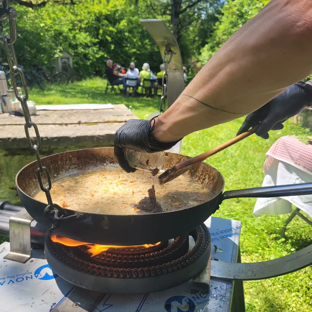 Foraged mushrooms cooking on outdoor pot, Zagori, Greece