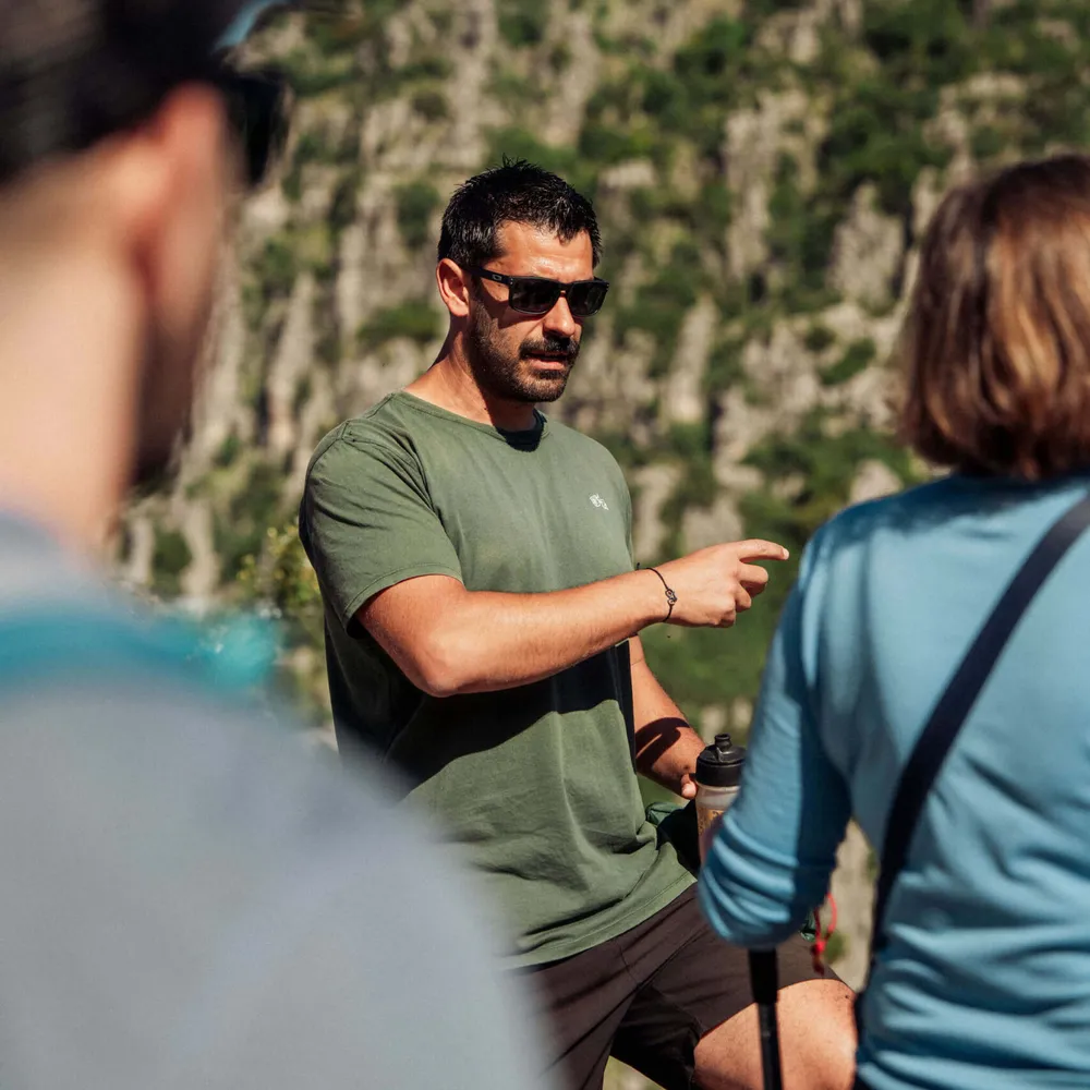 A Slow Cyclist Guide Speaking To Guests In Zagori Greece