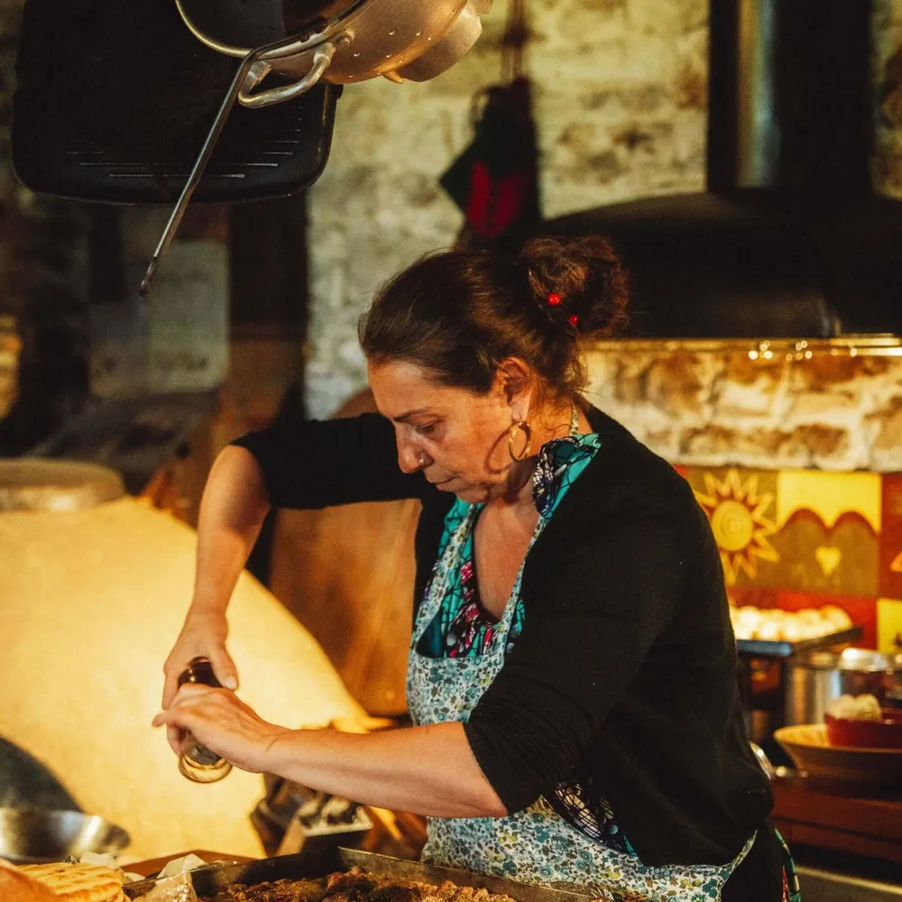 A chef preparing traditional Greek food for Slow Cyclists in Zagori, Greece.