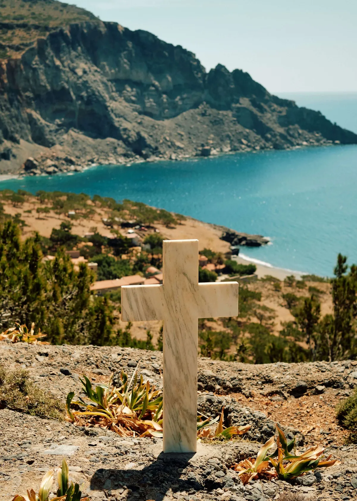 A cross overlooking the sea in Crete Greece Slow Cyclist