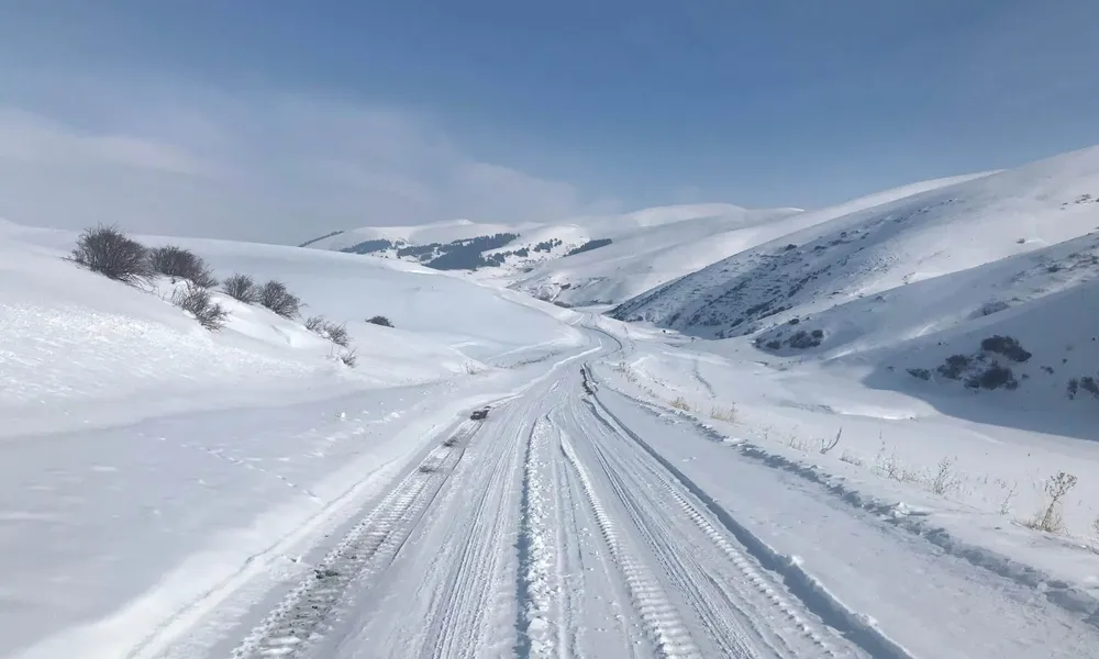 Snow and tire tracks in the Armenian highlands, seen on Emily's Slow Cyclist research trip.