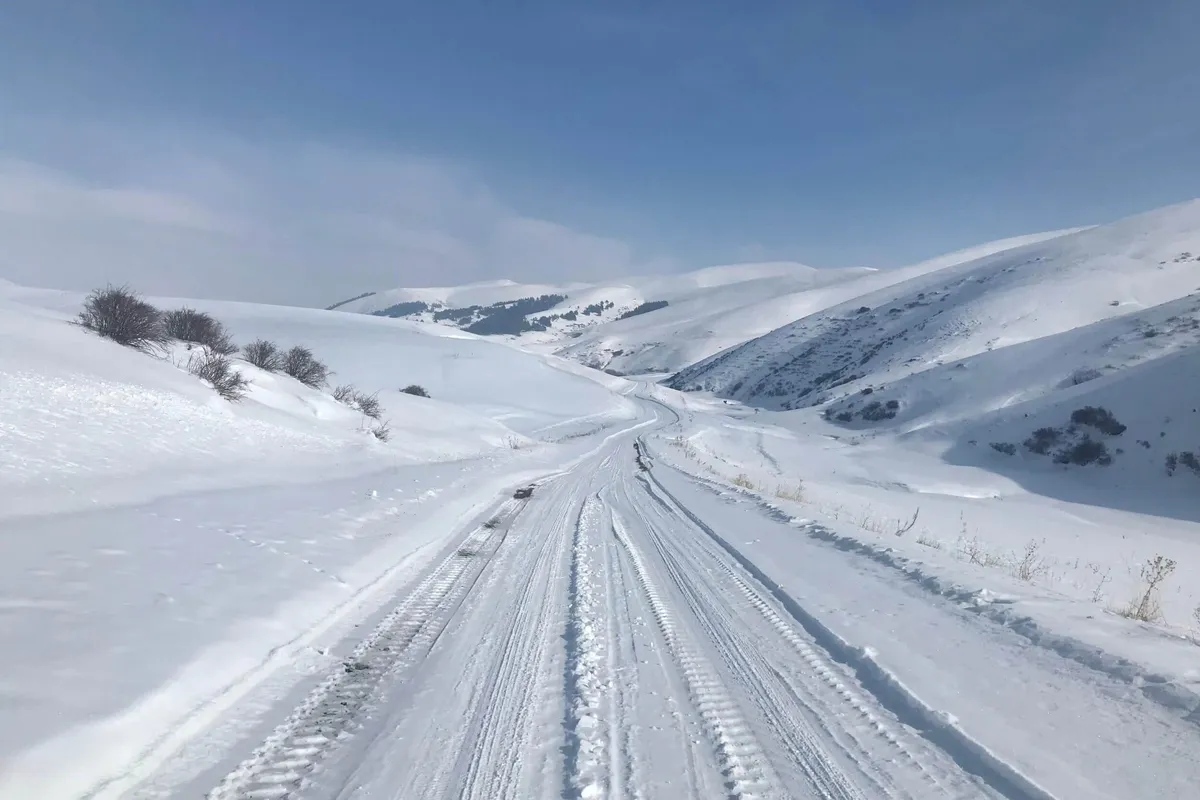 Snow and tire tracks in the Armenian highlands, seen on Emily's Slow Cyclist research trip.