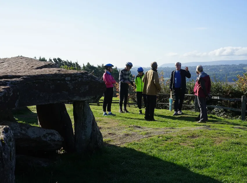Arthurs stone with cyclists standing talking, Heresfordshire, Uk, Emilys photos