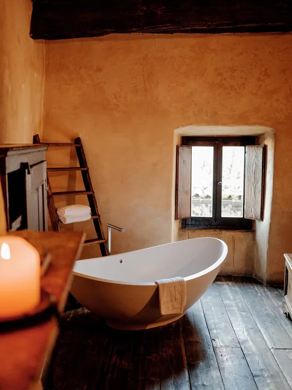 A bath in a traditional room at Sextantio Albergo Diffuso