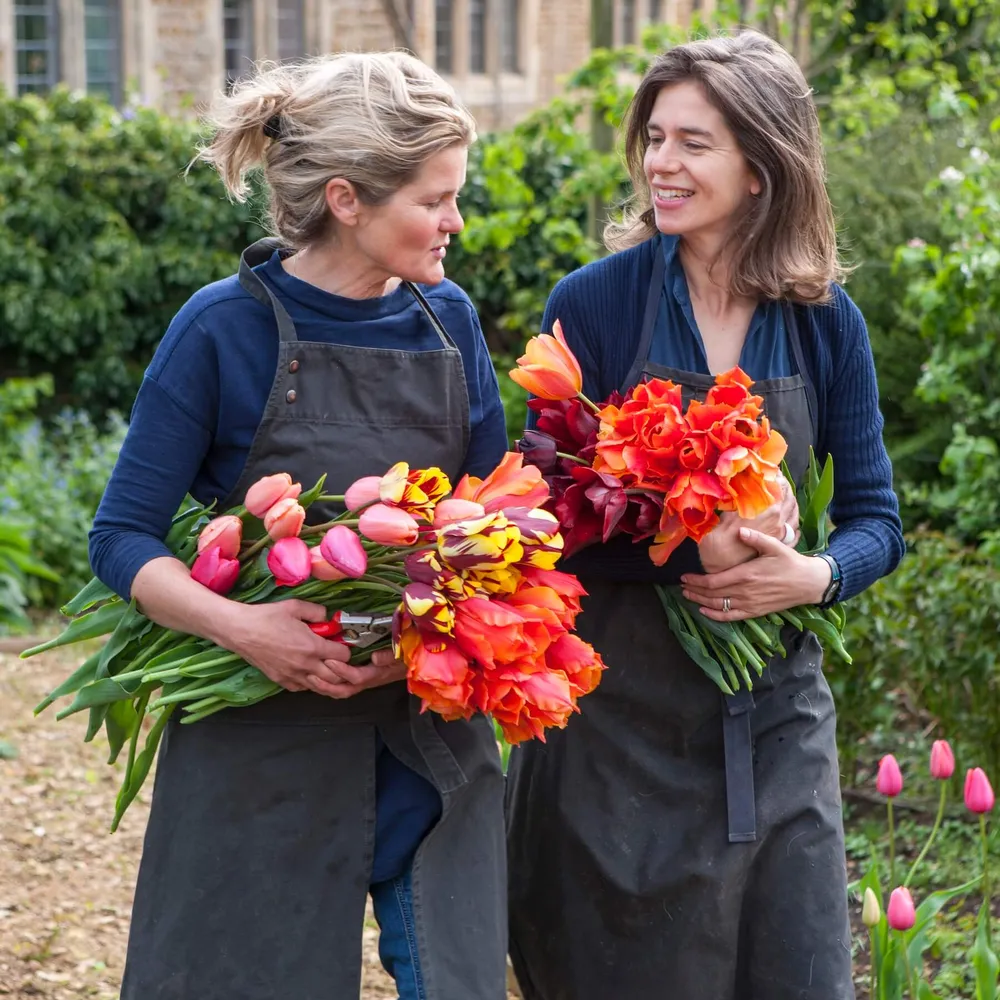 Bridget and Henrietta - The Land Gardeners - with large bunches of tulips