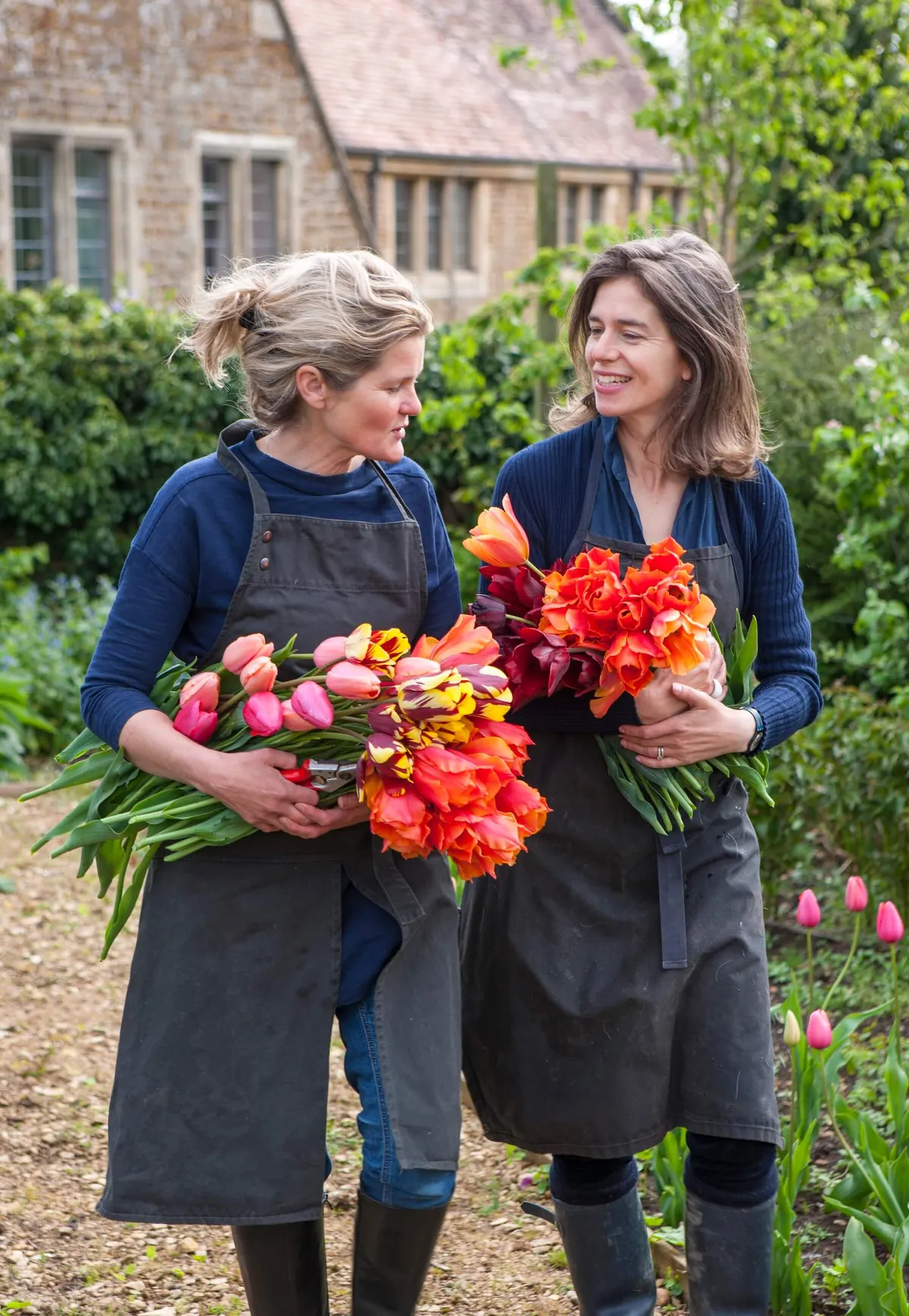 Bridget and Henrietta - The Land Gardeners - with large bunches of tulips