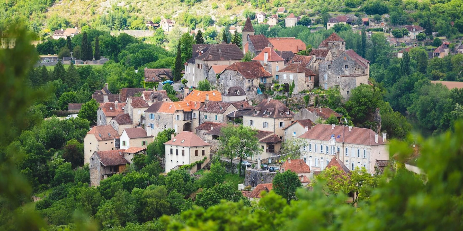 The village of Calvignac among the trees in France's Quercy region