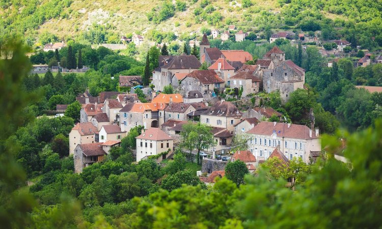 The village of Calvignac among the trees in France's Quercy region