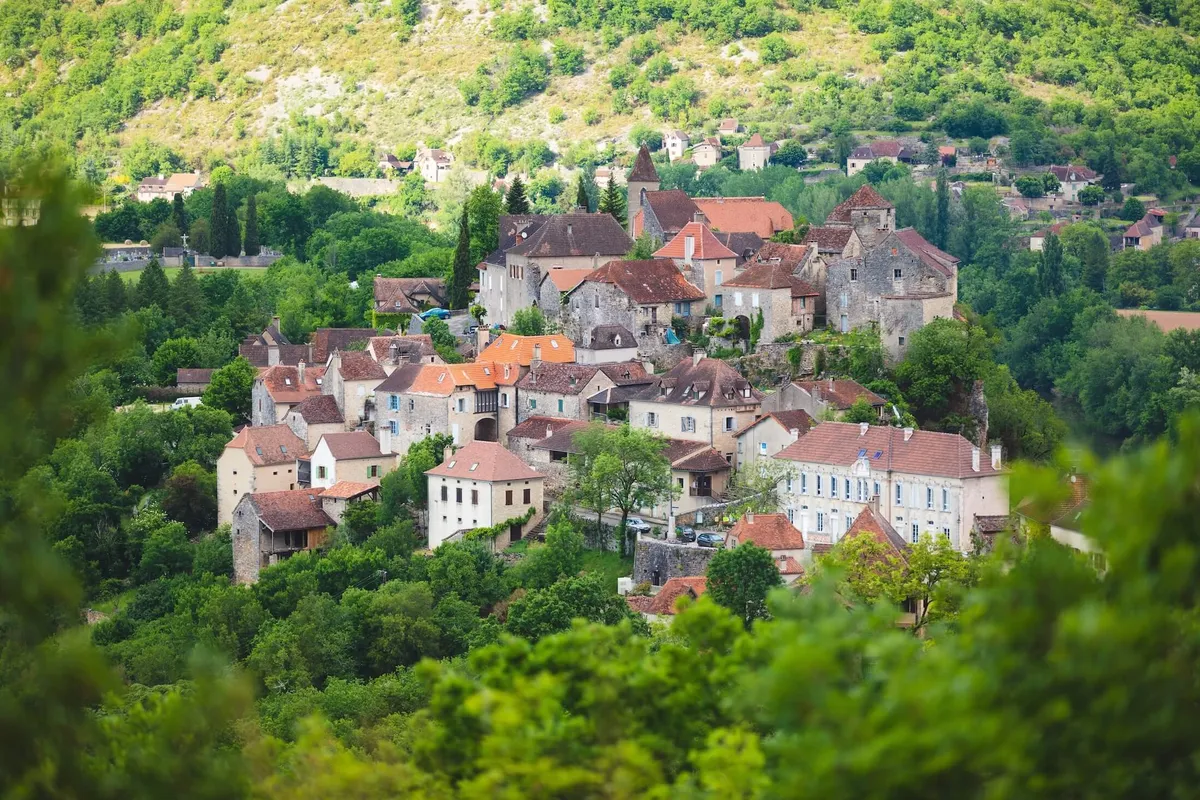 The village of Calvignac among the trees in France's Quercy region