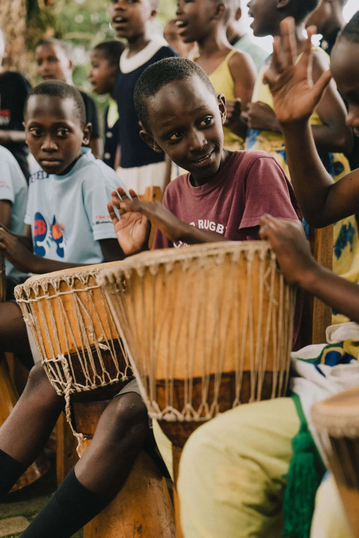 Children okaying the drums at the Kinamba Project in Kigali, Rwanda