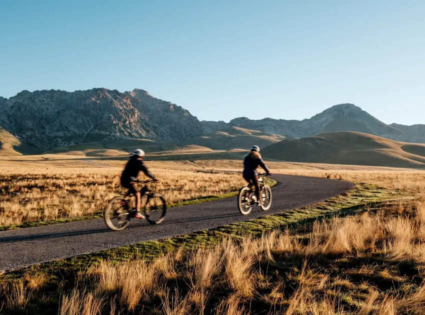 Two Slow Cyclists cycling through the mountains to Campo Imperatore in Gran Sasso, Abruzzo