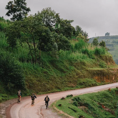 cycling on rwanda hill side through hills and trees