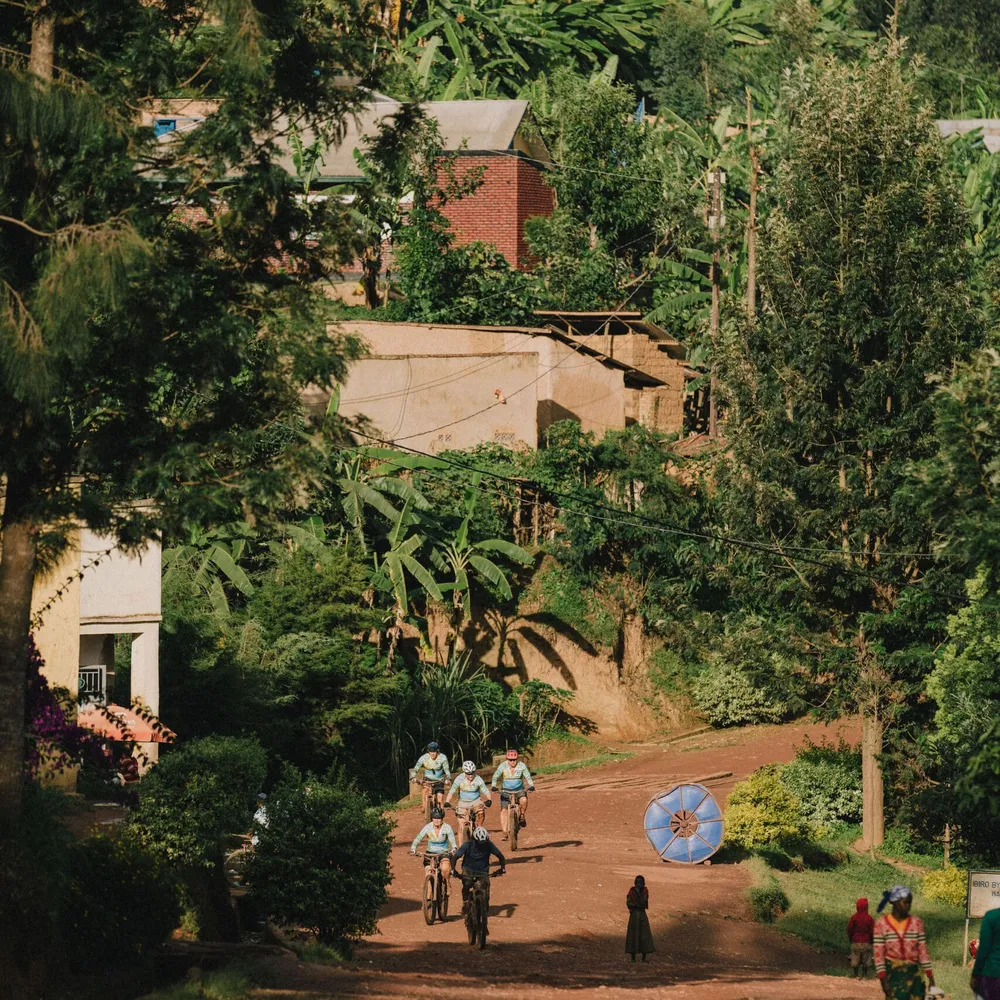 Slow Cyclist guests cycling through the villages of Rwanda