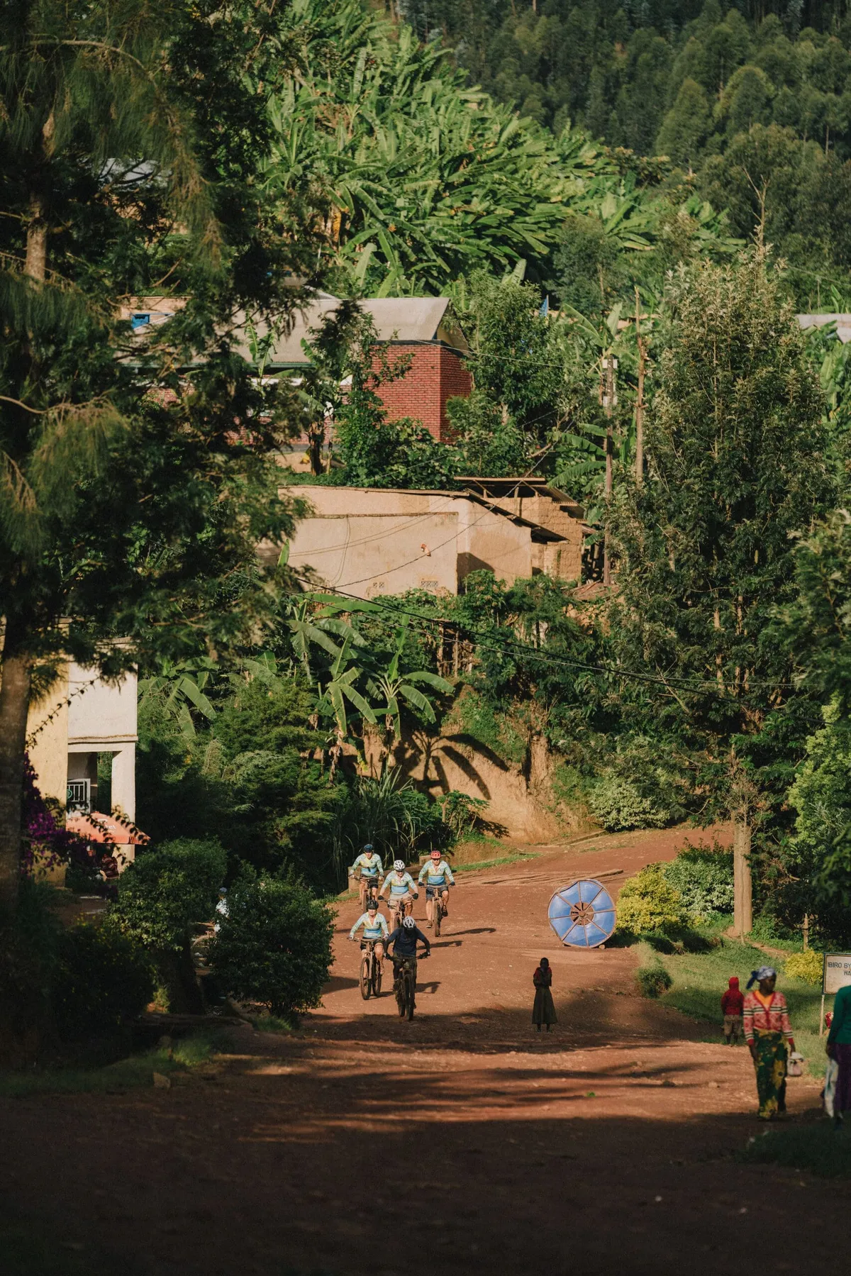 Slow Cyclist guests cycling through the villages of Rwanda