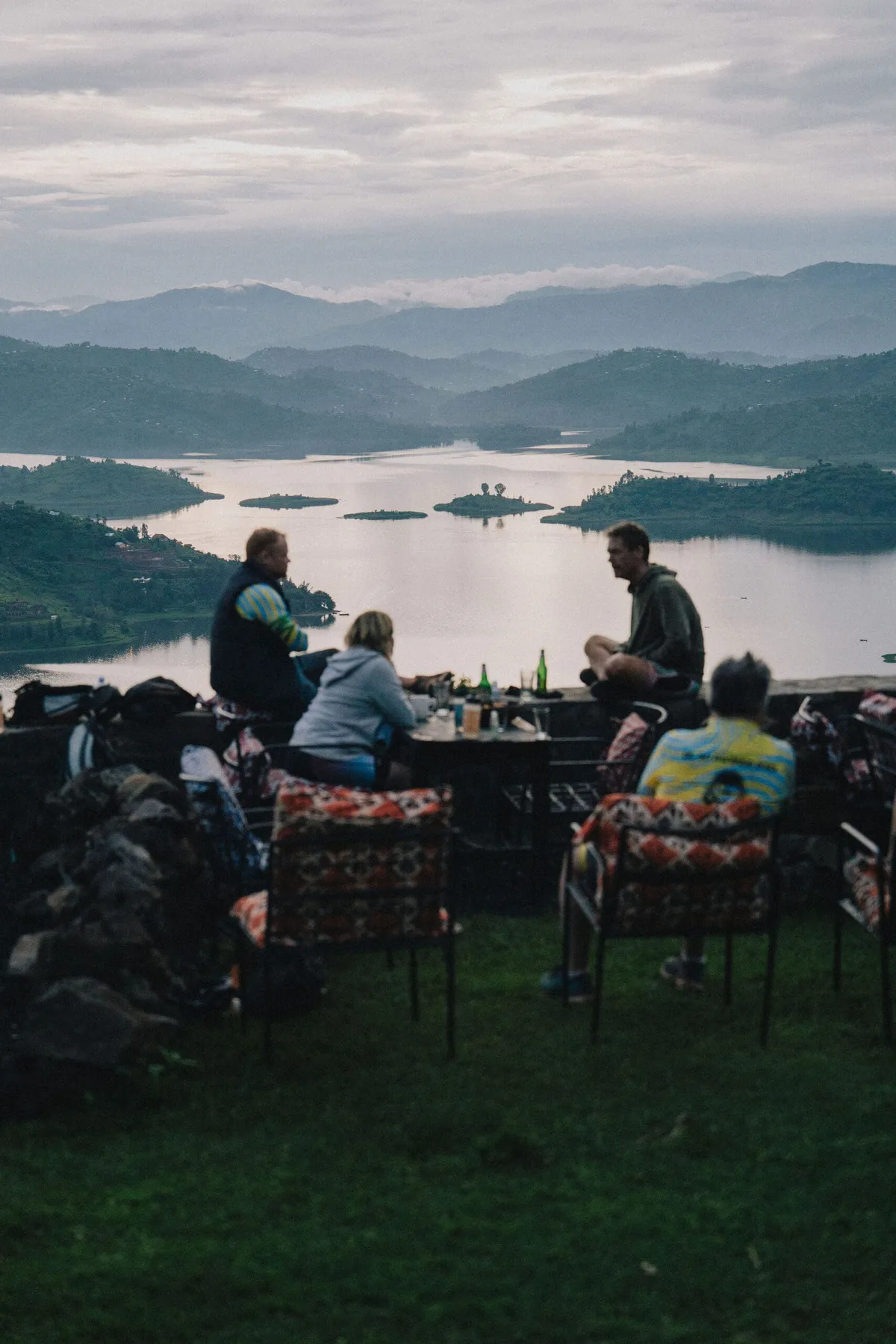 Slow Cyclist guests enjoying a drink overlooking Lake Ruhondo in Rwanda