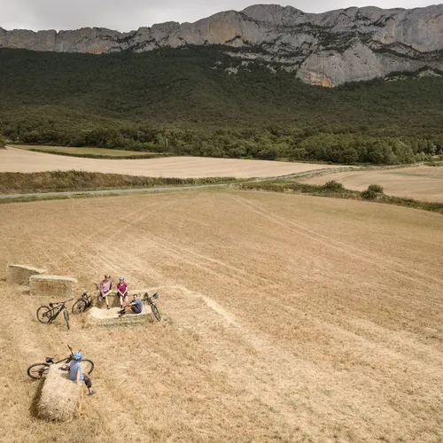 Fields and cyclists in front of the mountains, The Spanish Basque, Spain
