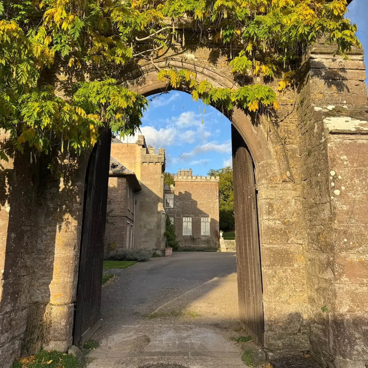 Flagstone archway with greenery, White Heron Estate Herefordshire