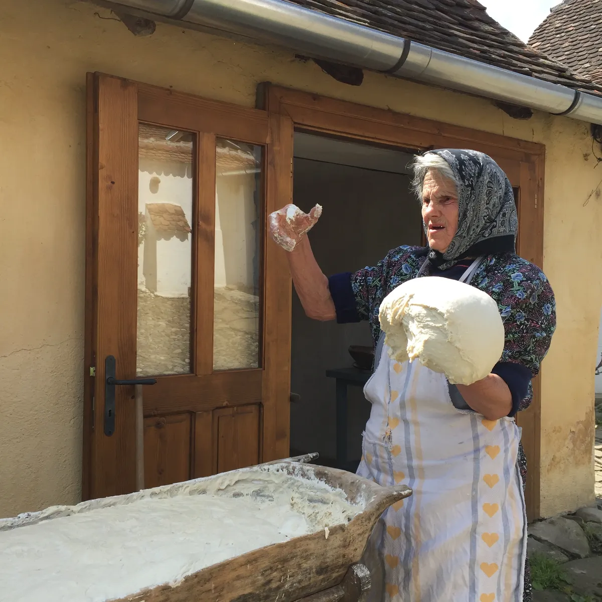 Transylvanian woman making bread, Transylvania, Romania