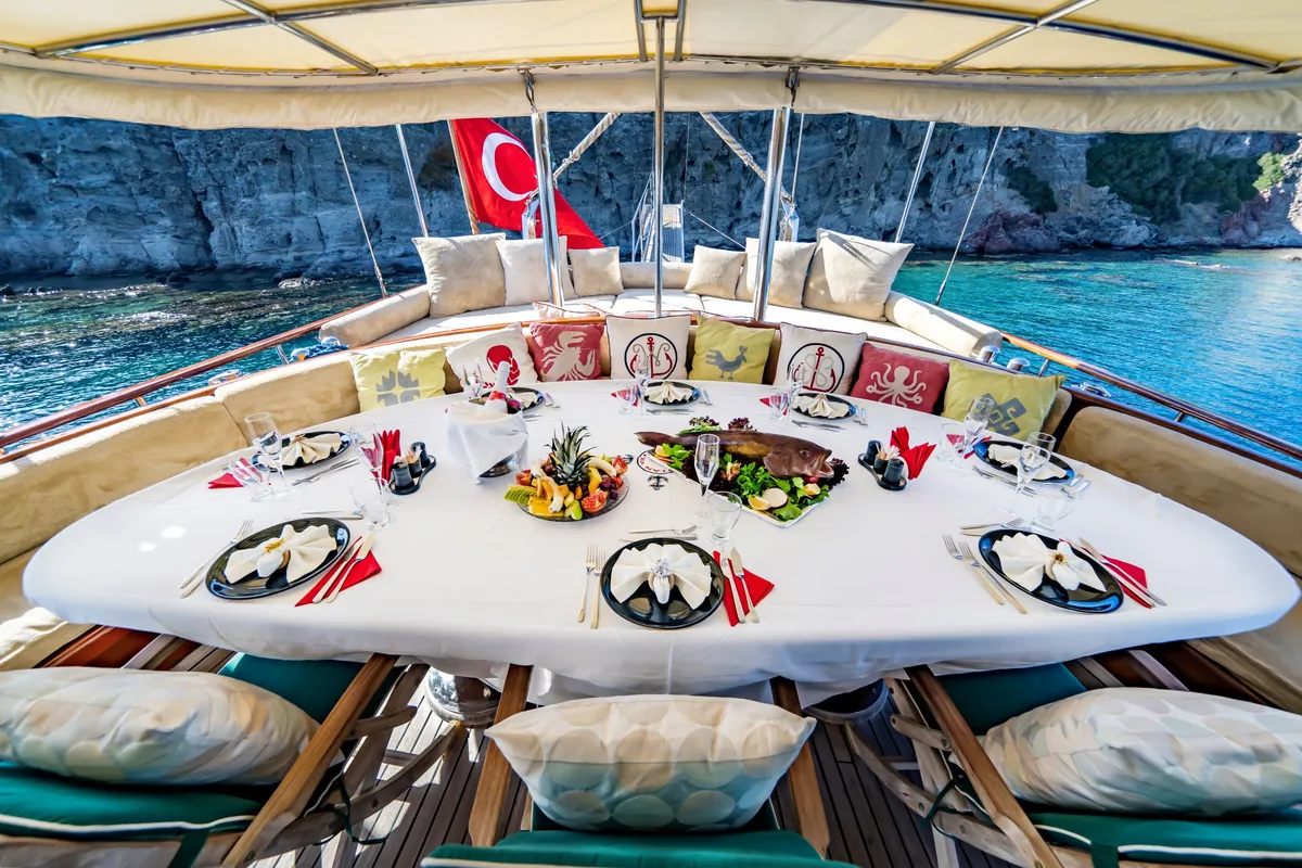 Dining table set up on a traditional Turkish gulet, Dodecanese Islands