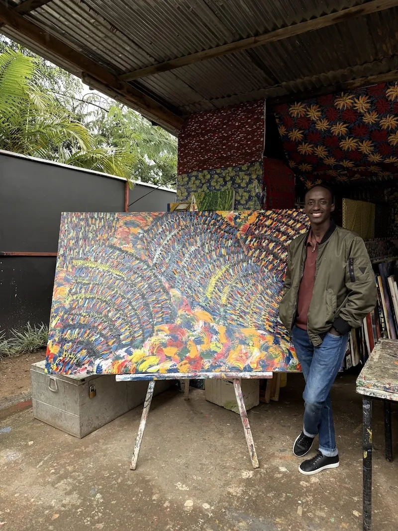 Artist with painting in Kigali, Northern Rwanda