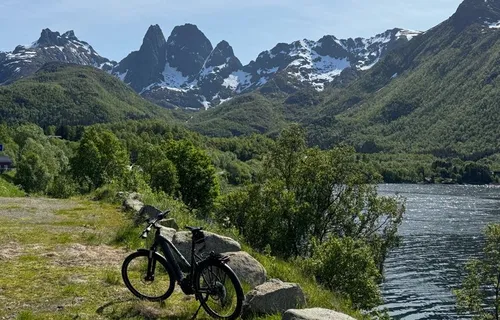 Electric bike next to fjord, Vesteralen Islands, Norway