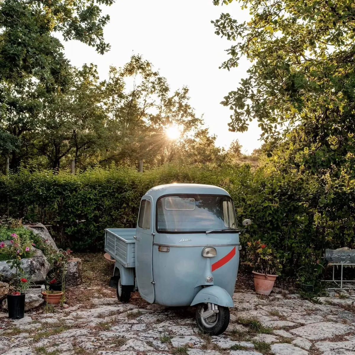 Italian 3-wheeled car on cobbled floor, Abruzzo, Italy