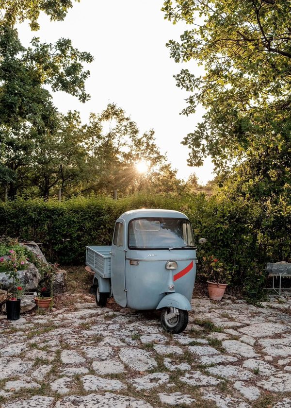 Italian 3-wheeled car on cobbled floor, Abruzzo, Italy