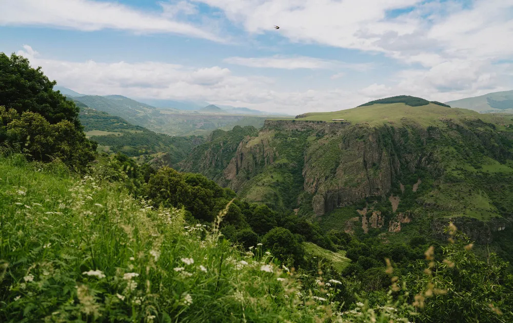 Looking-out-over-a-gorge-and-mountains-on-a-Slow-Cyclist-journey-in-Armenia