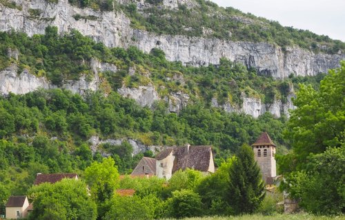Marcilhac-sur-Célé and the limestone Causses behind in France's Quercy