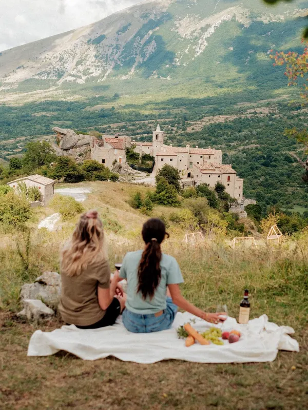 Two Slow Cyclists enjoy a picnic overlooking the hamlet of Roccacaramanico