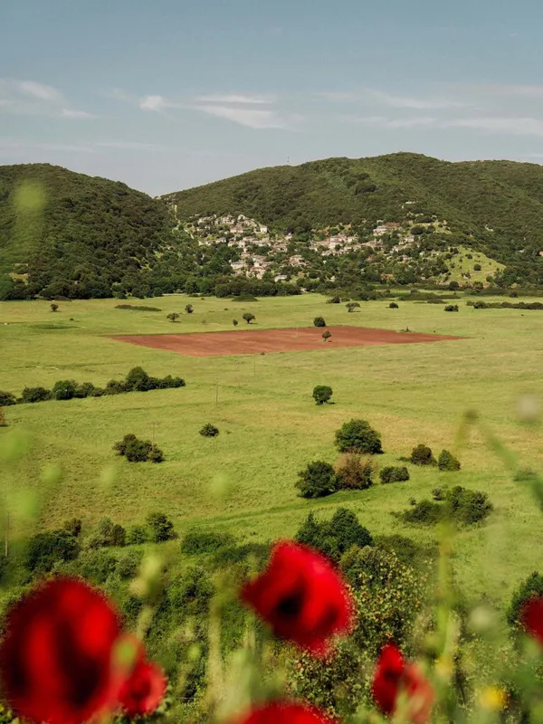 Poppies, fields and mountains seen a journey through Zagori, Greece with The Slow Cyclist.