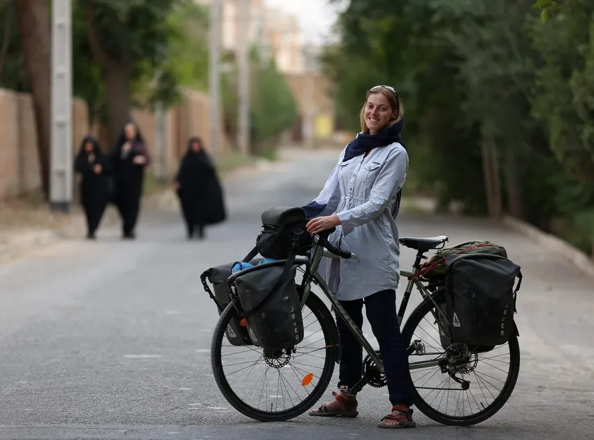 Rebecca Lowe, author of The Slow Road to Tehran, on her bike in Iran