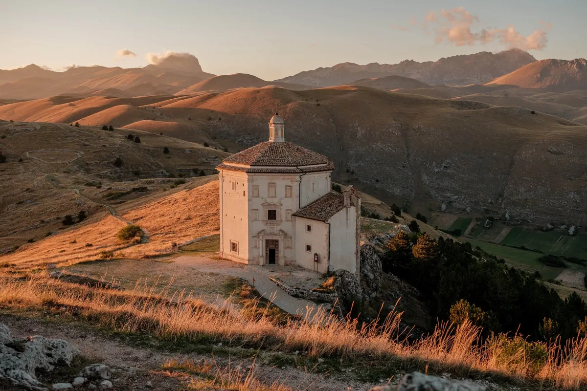 Octagonal Santa Maria della Pieta church at sunset in Gran Sasso National Park