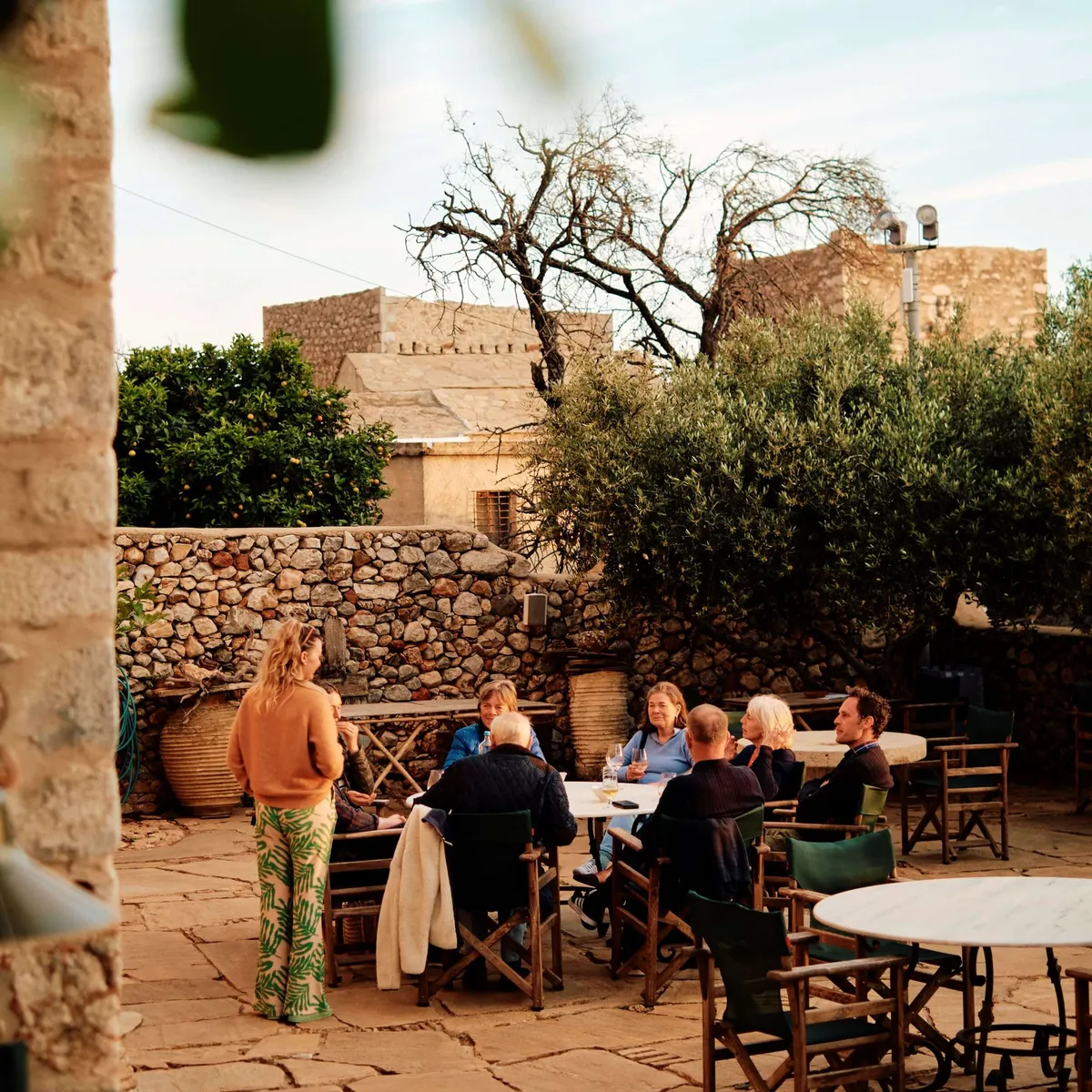 Slow Cyclist guests enjoying a meal outside in the Mani, Greece