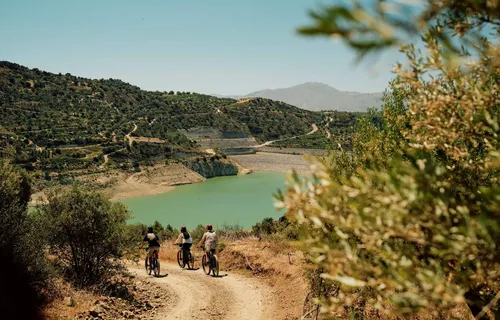 Slow Cyclists on a track by the gorge, Crete, Greece
