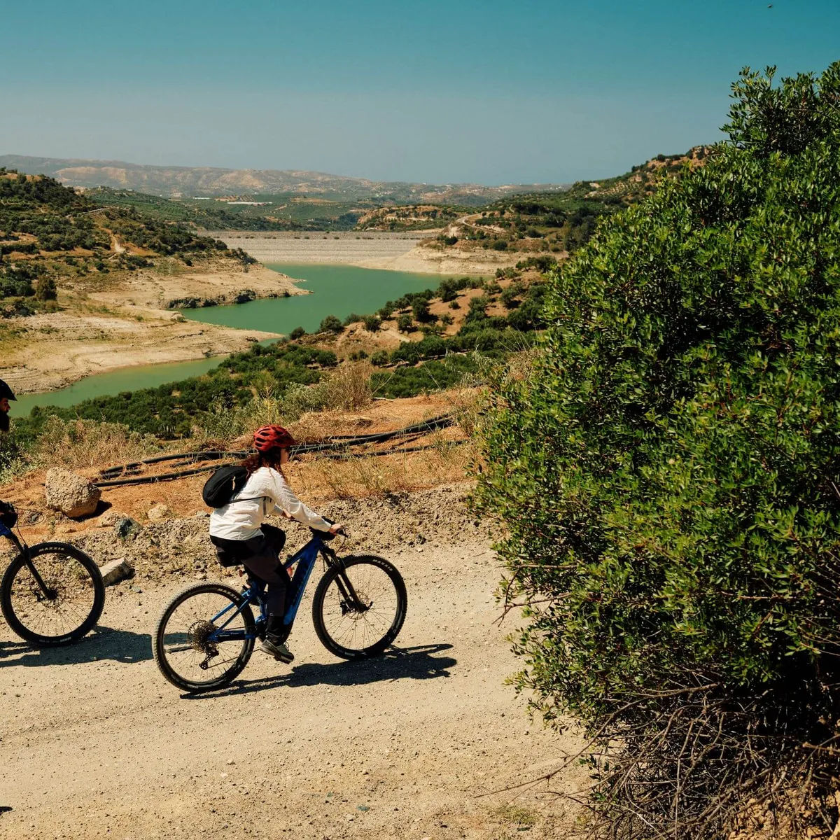 Slow Cyclists in Crete, Greece, cycling alongside the gorge