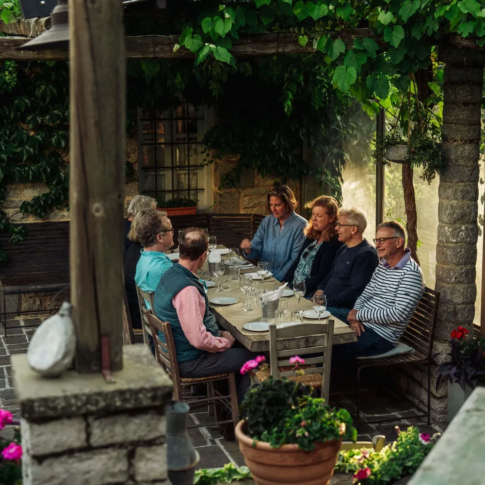 Slow Cyclist guests enjoying a table picnic lunch in Zagori, Greece.