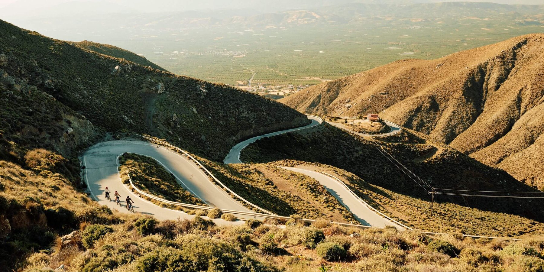Slow-Cyclists-on-winding-roads-in-Crete-Greece