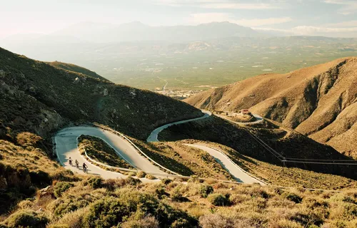 Slow-Cyclists-on-winding-roads-in-Crete-Greece