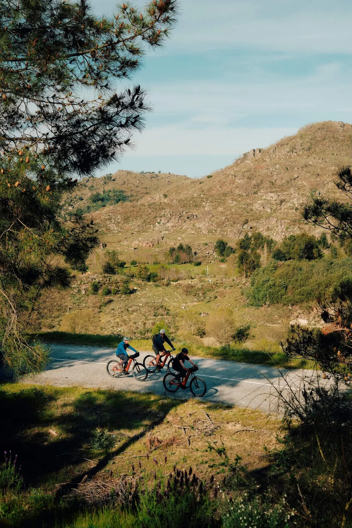 A group of Slow Cyclists cycling through the rugged landscapes of Portugal's Coa Valley