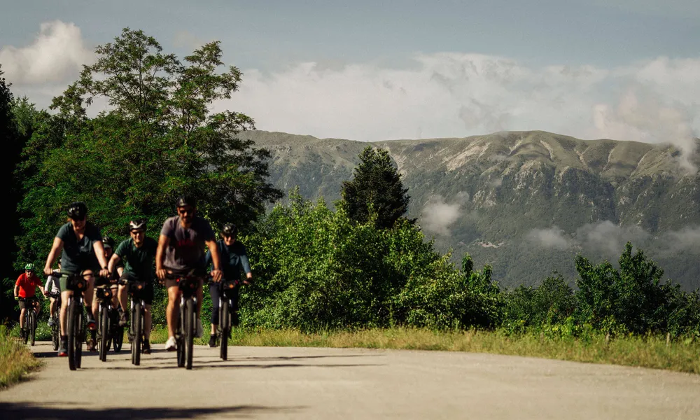 Slow-Cyclists-riding-through-the-mountains-of-Zagori-Greece