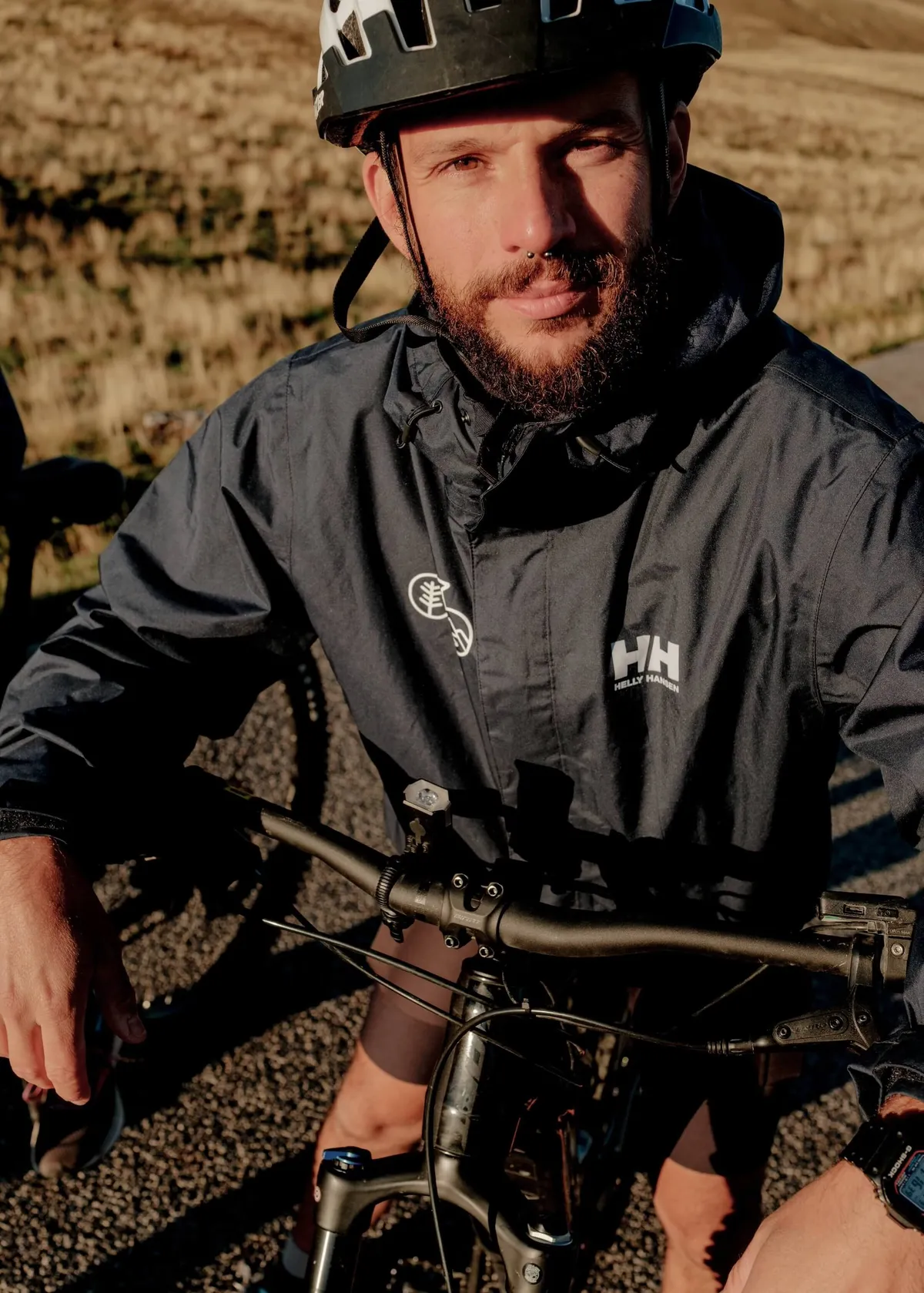 Slow Cyclist leaning on bike, campo imperatore, Abruzzo,Italy