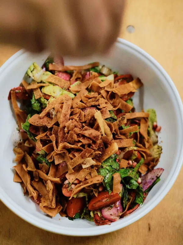 The team at Imad's Syrian Kitchen preparing food for guests at The Slow Table, hosted by The Slow Cyclist and The Grange Winery