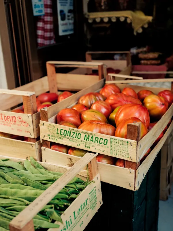 Crates of tomatoes and beans at a market in Abruzzo's Caramanico