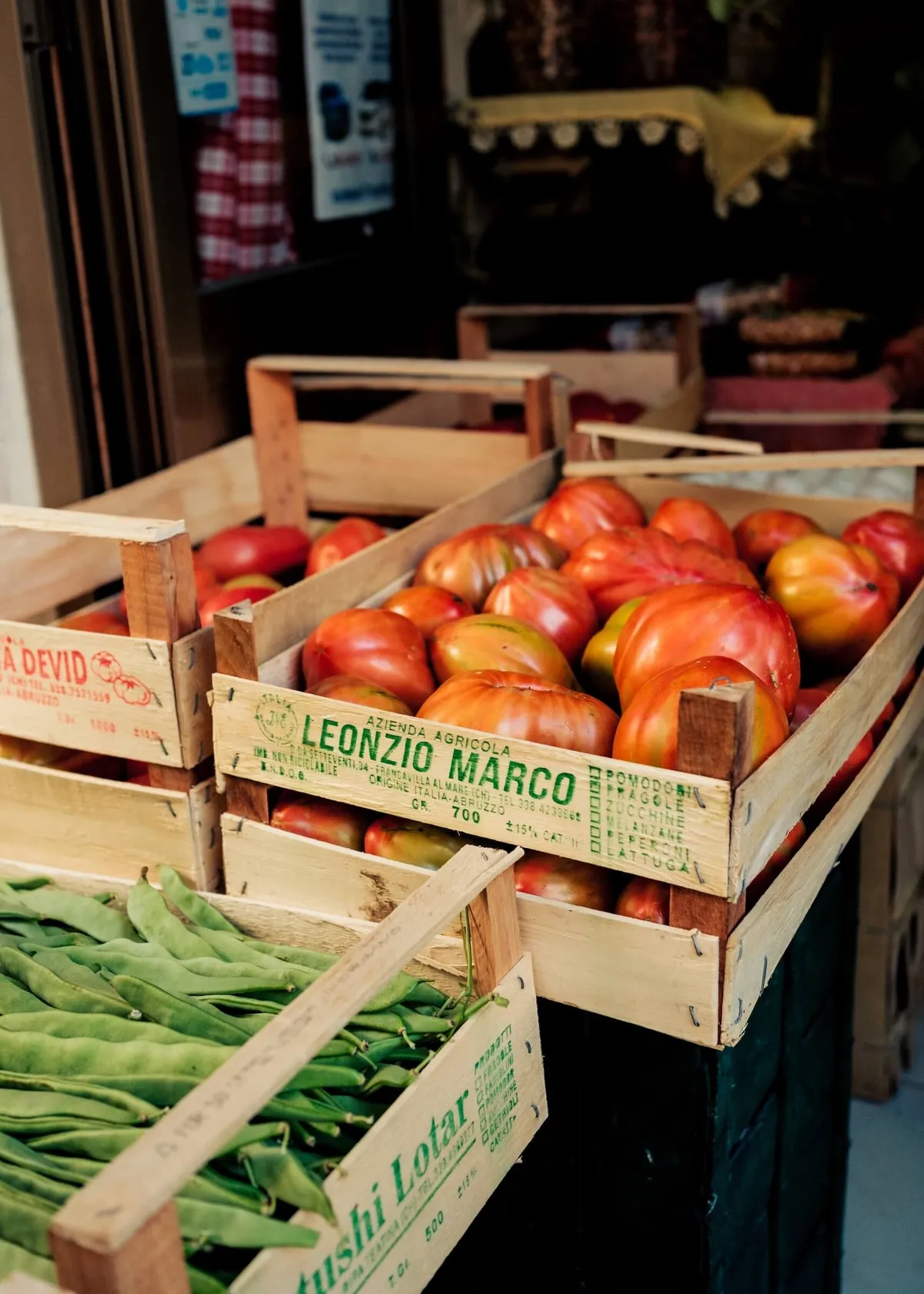 Crates of tomatoes and beans at a market in Abruzzo's Caramanico