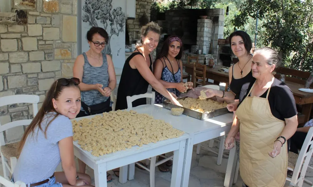 Slow Cyclists cooking traditional Cretan food
