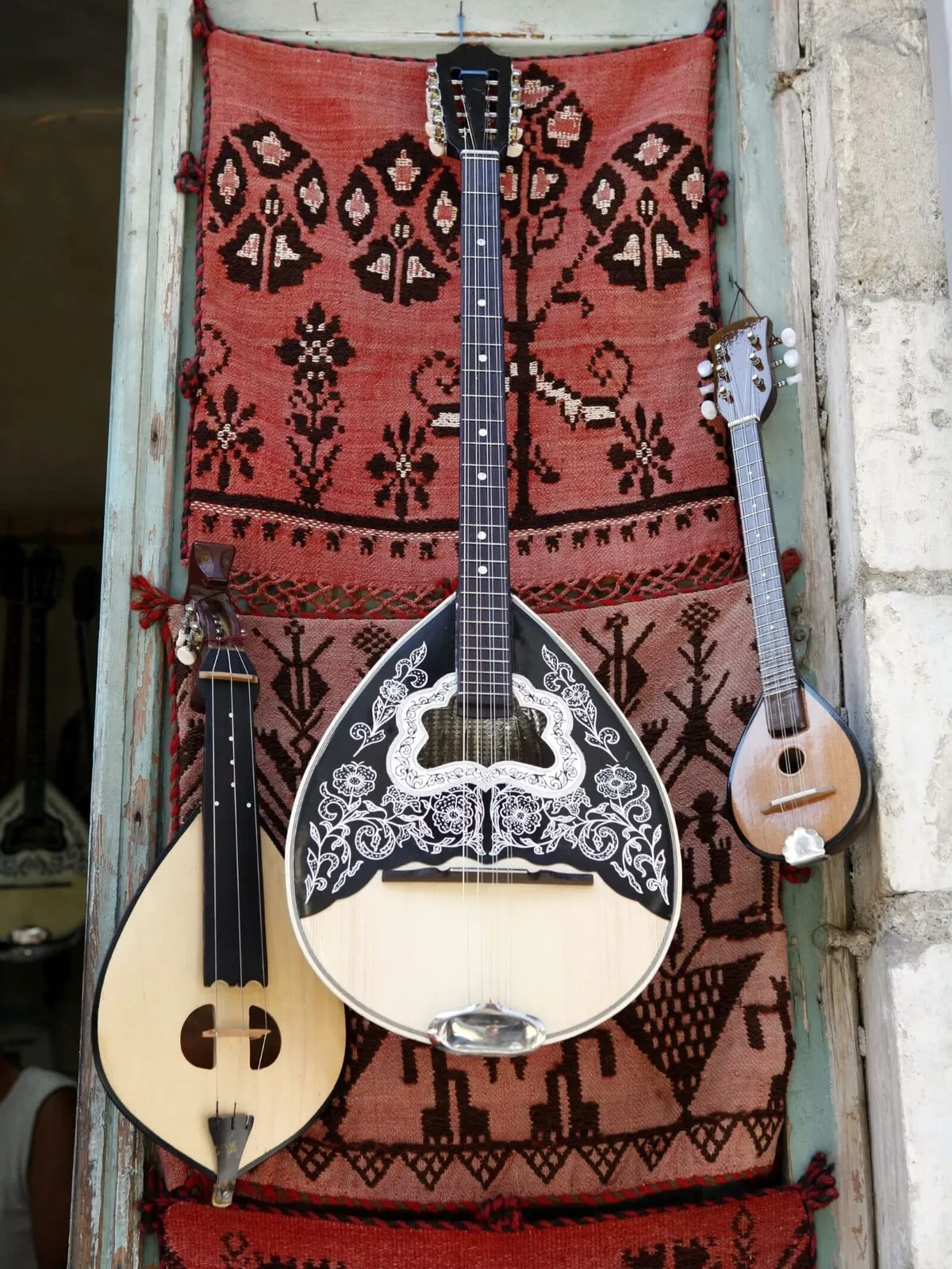 Traditional instruments of Crete, including the lyra, often heard on a Slow Cyclist journey