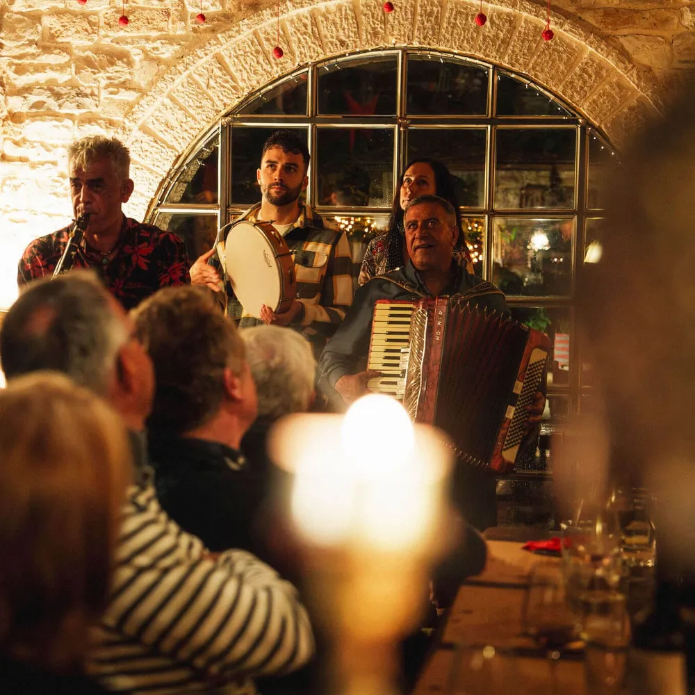 Traditional musicians playing Greek music for Slow Cyclists in Zagori.