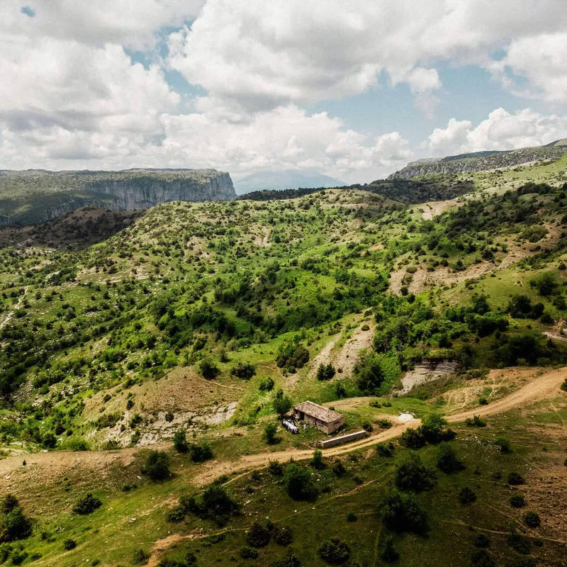 A view over mountains, gorges and trees in Zagori, Greece, visited on a Slow Cyclist journey.
